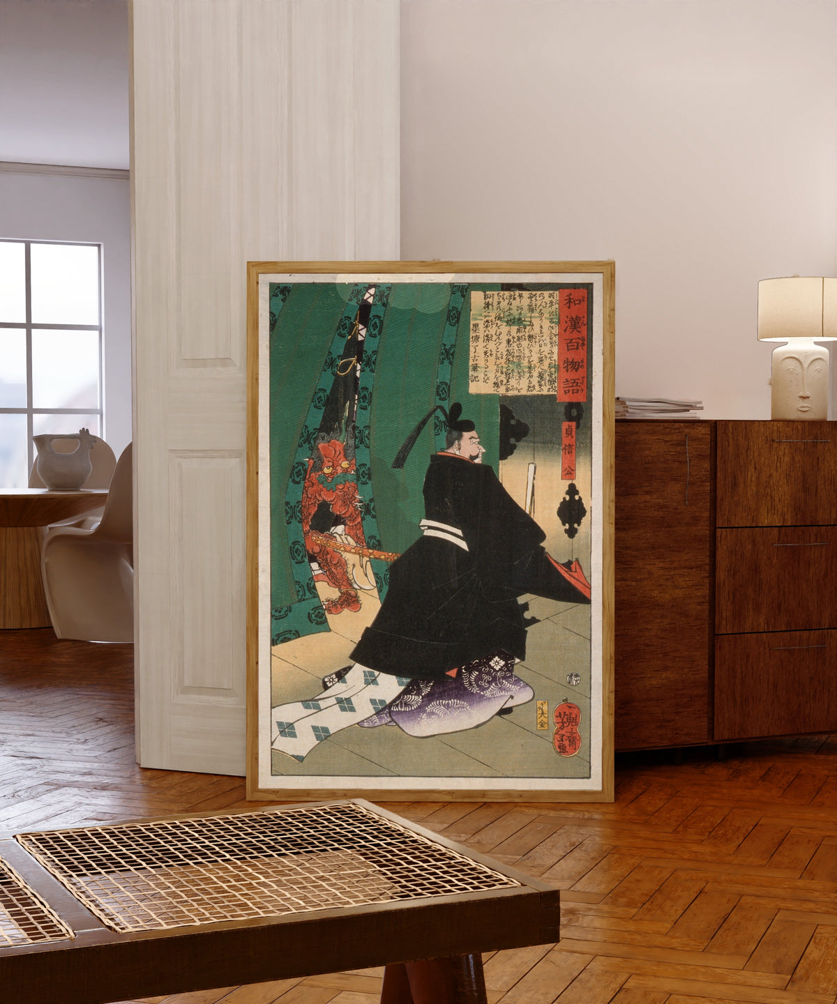 Framed art print of I Want to Show You the Cherry Blossoms in Full… by Tsukioka Yoshitoshi, in a light wood frame leaning in a warm room with a parquet floor