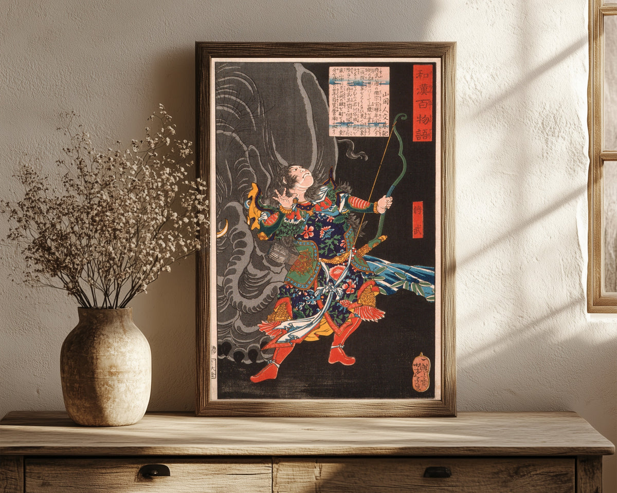 Framed art print of Jiang Wu (Shōbu) and the Elephant by Tsukioka Yoshitoshi, in a dark wood frame leaning on a rustic console beside dried flowers