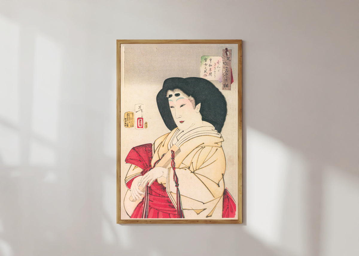 Framed art print of Looks Refined (Kyōwa-era Court Lady) by Tsukioka Yoshitoshi, in a light wood frame on a sunlit white wall