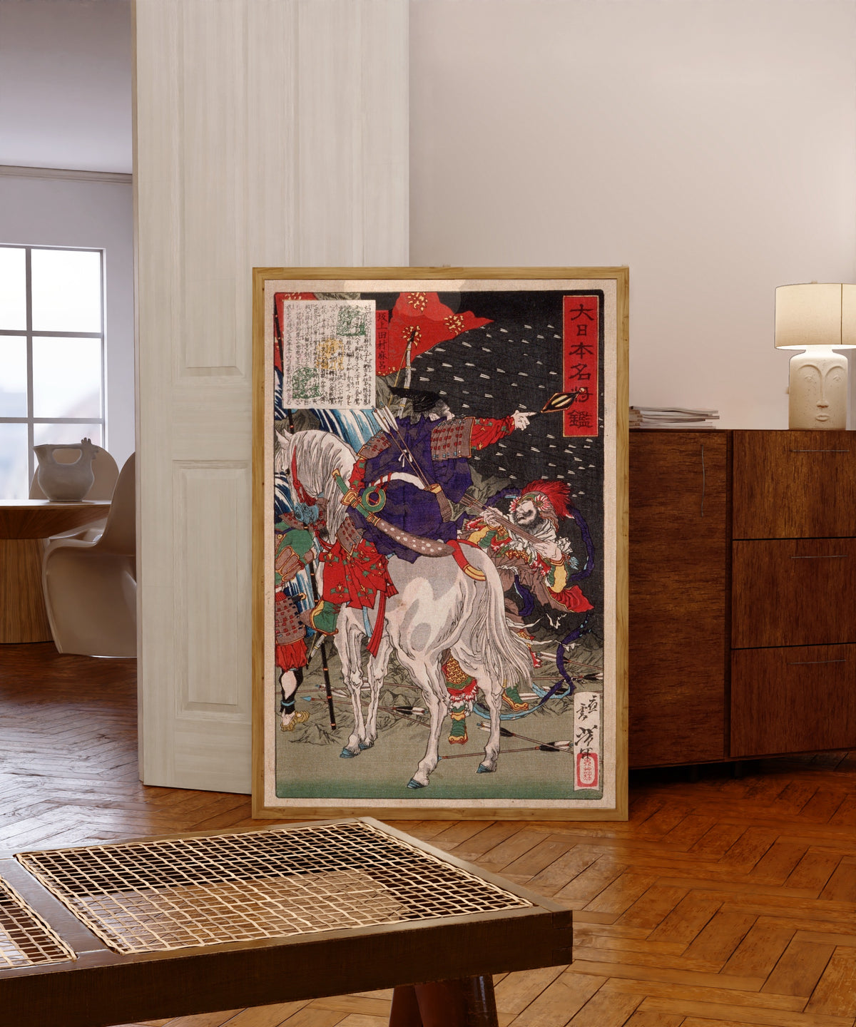 Framed art print of Sakanoue Tamuramaro in Rain of Arrows by Tsukioka Yoshitoshi, in a light wood frame leaning in a warm room with a parquet floor