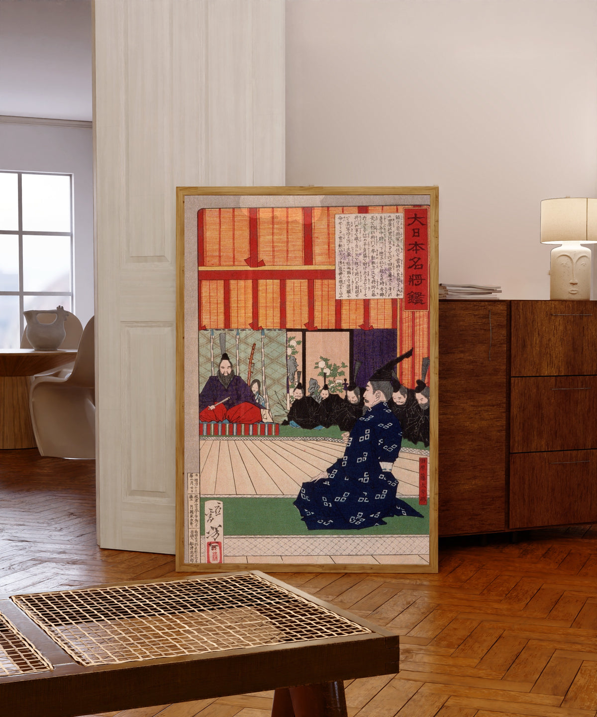 Framed art print of Tawara Tōda Hidesato in Audience with the Emperor by Tsukioka Yoshitoshi, in a light wood frame leaning in a warm room with a parquet floor