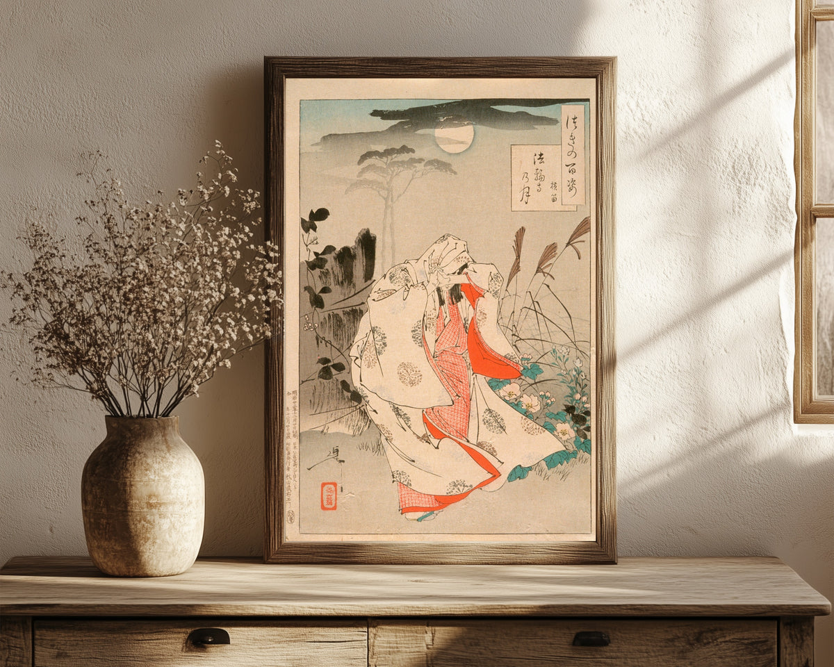 Framed art print of Yokobue Waiting from Takiguchi Tokiyori by Tsukioka Yoshitoshi, in a dark wood frame leaning on a rustic console beside dried flowers