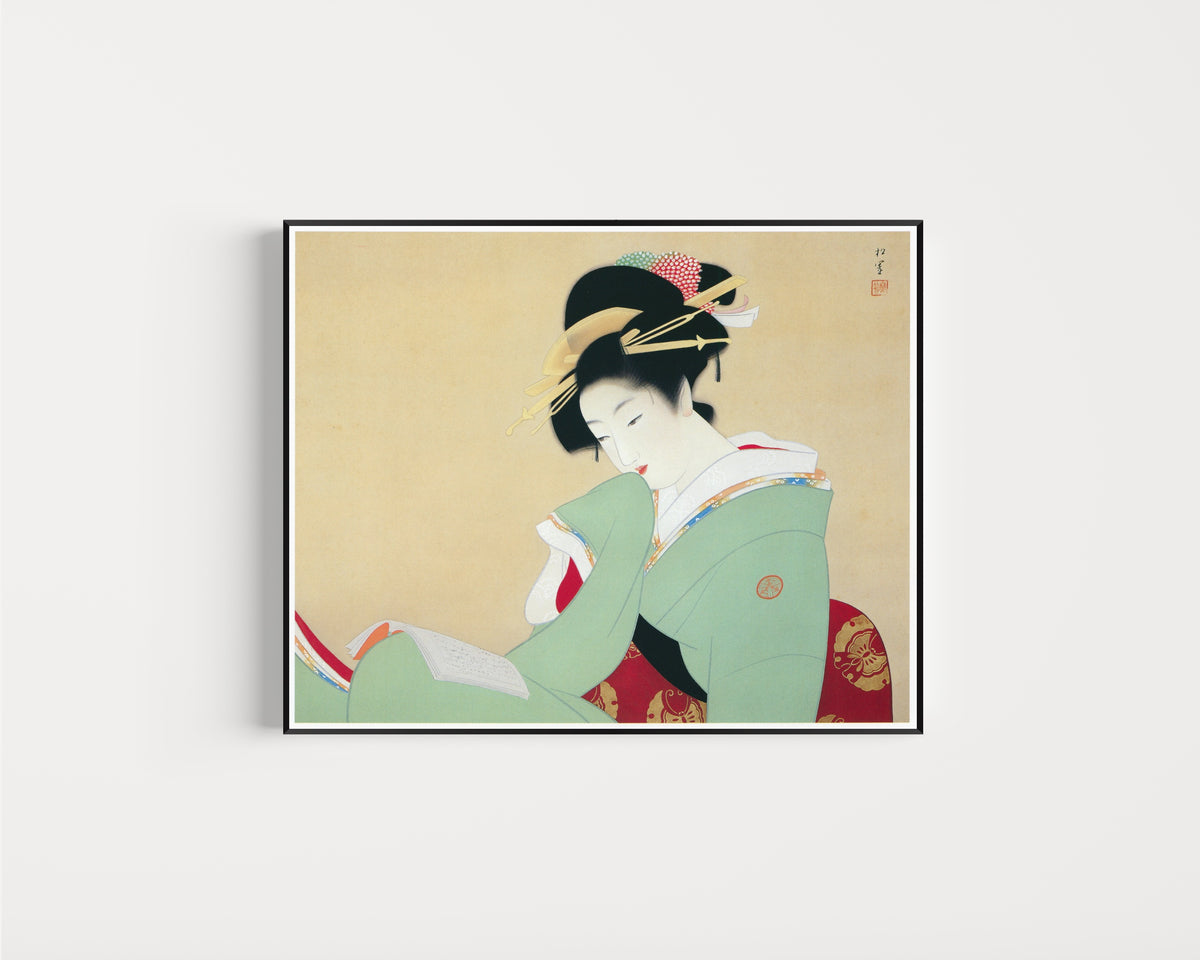 Framed art print of Beautiful Woman Reading a Book by Uemura Shōen, in a slim black frame on a plain white wall