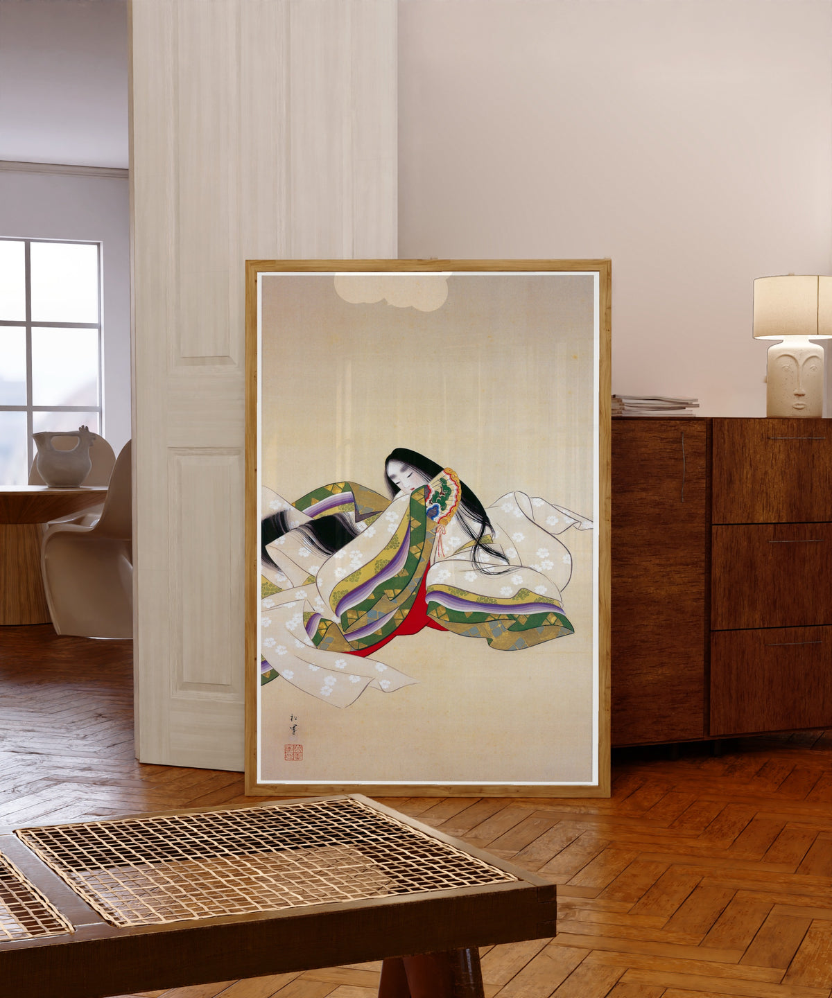 Framed art print of Jōrō (Court Lady) by Uemura Shōen, in a light wood frame leaning in a warm room with a parquet floor