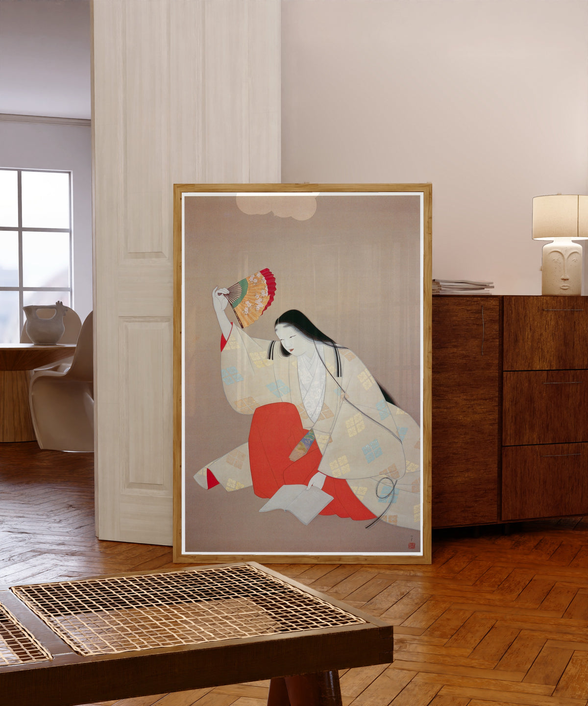 Framed art print of Ono no Komachi by Uemura Shōen, in a light wood frame leaning in a warm room with a parquet floor