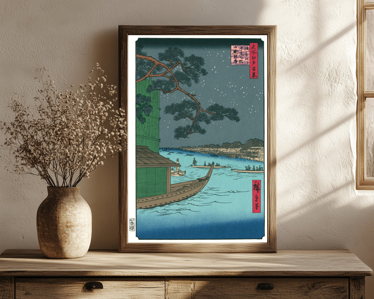 Framed art print of 100 Views of Edo: Asakusa River, Shubi Pine… by Utagawa Hiroshige, in a dark wood frame leaning on a rustic console beside dried flowers