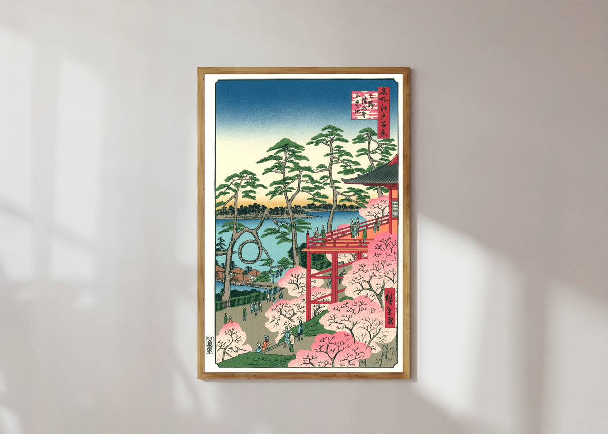 Framed art print of Kiyomizu Hall and Shinobazu Pond at Ueno by Utagawa Hiroshige, in a light wood frame on a sunlit white wall