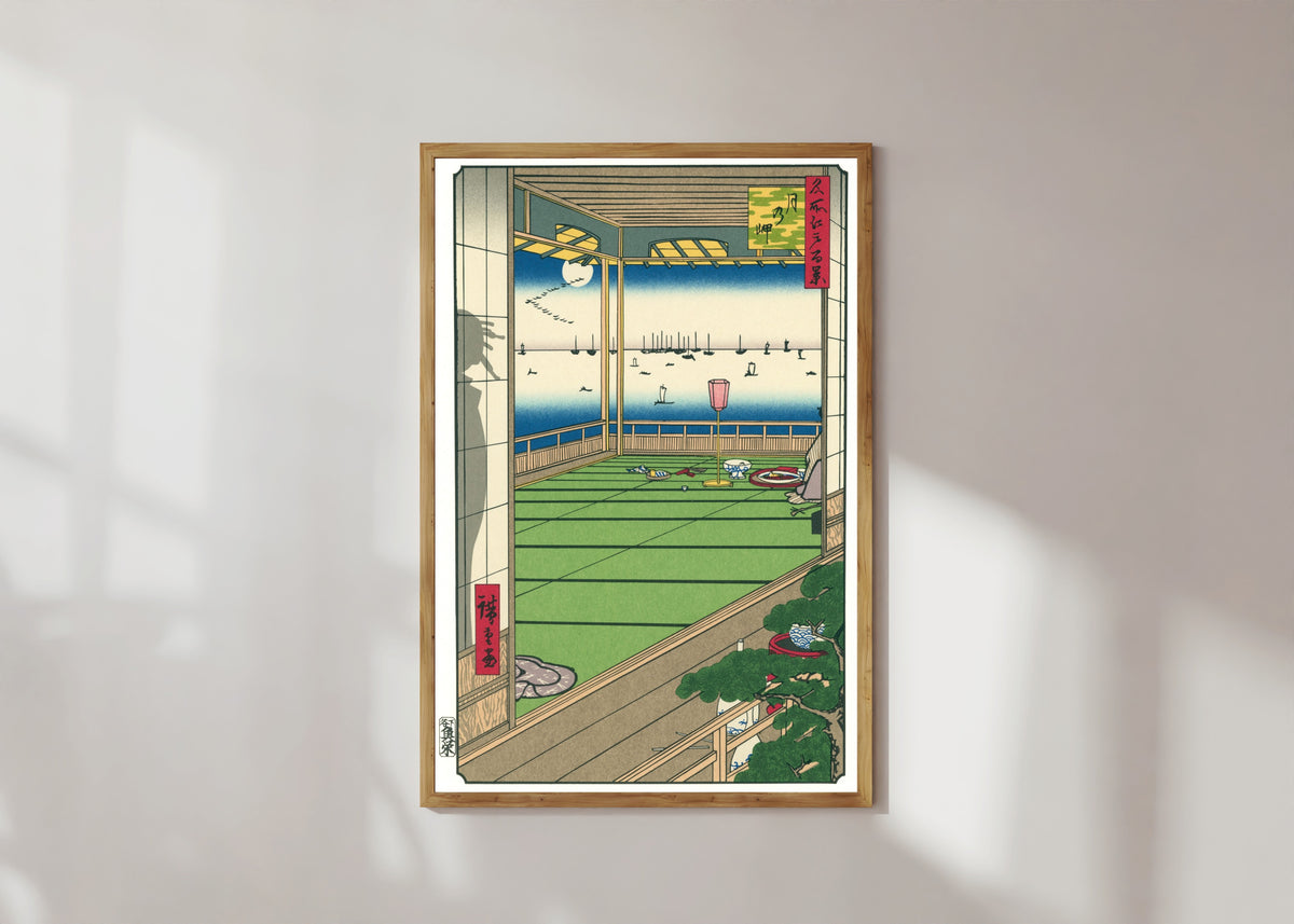 Framed art print of Moon Viewing by Utagawa Hiroshige, in a light wood frame on a sunlit white wall