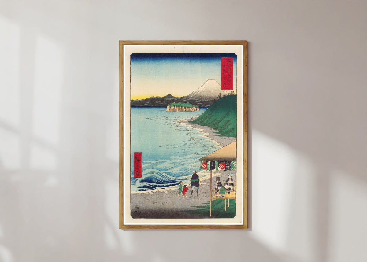Framed art print of The Seven Ri Beach in Sagami Province by Utagawa Hiroshige, in a light wood frame on a sunlit white wall