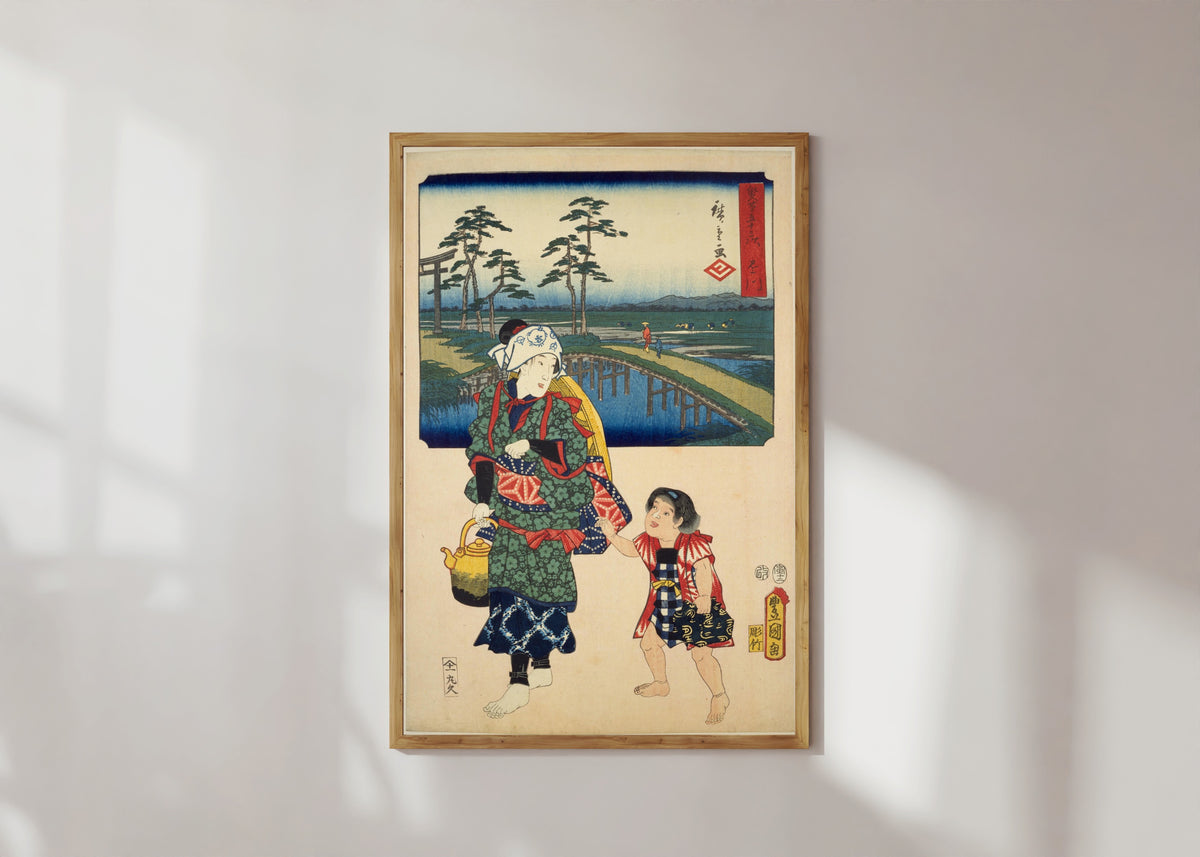 Framed art print of Fifty-three Stations by Two Brushes: Kakegawa by Utagawa Hiroshige & Utagawa Kunisada, in a light wood frame on a sunlit white wall
