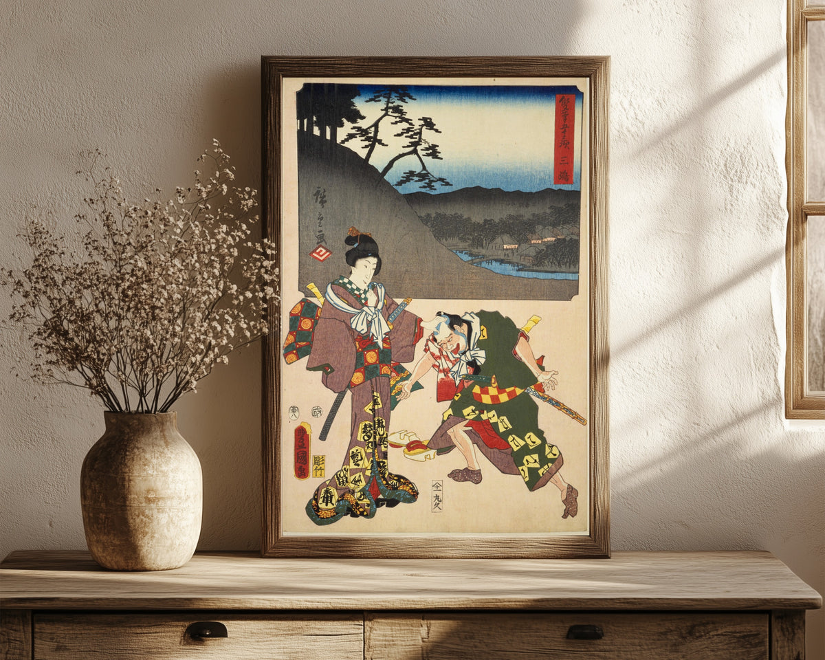 Framed art print of Fifty-three Stations by Two… by Utagawa Hiroshige & Utagawa Kunisada, in a dark wood frame leaning on a rustic console beside dried flowers
