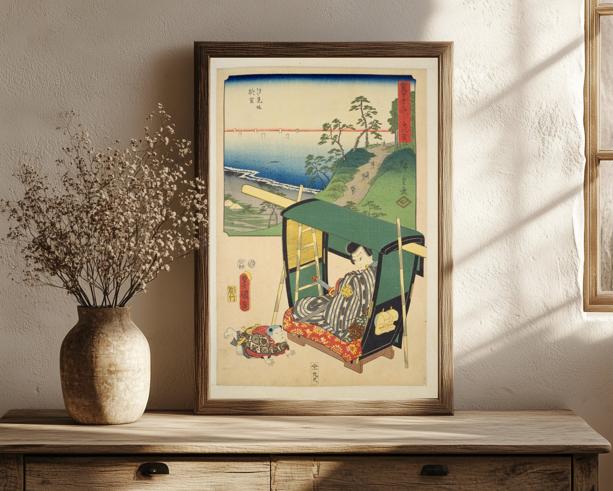 Framed art print of Fifty-three Stations by Two… by Utagawa Hiroshige & Utagawa Kunisada, in a dark wood frame leaning on a rustic console beside dried flowers