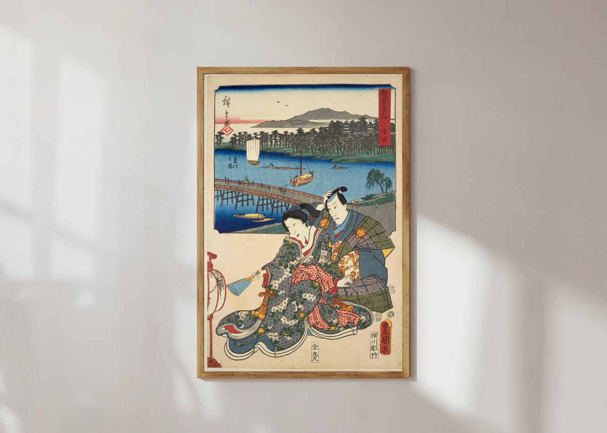Framed art print of Fifty-three Stations by Two Brushes: Yoshida by Utagawa Hiroshige & Utagawa Kunisada, in a light wood frame on a sunlit white wall