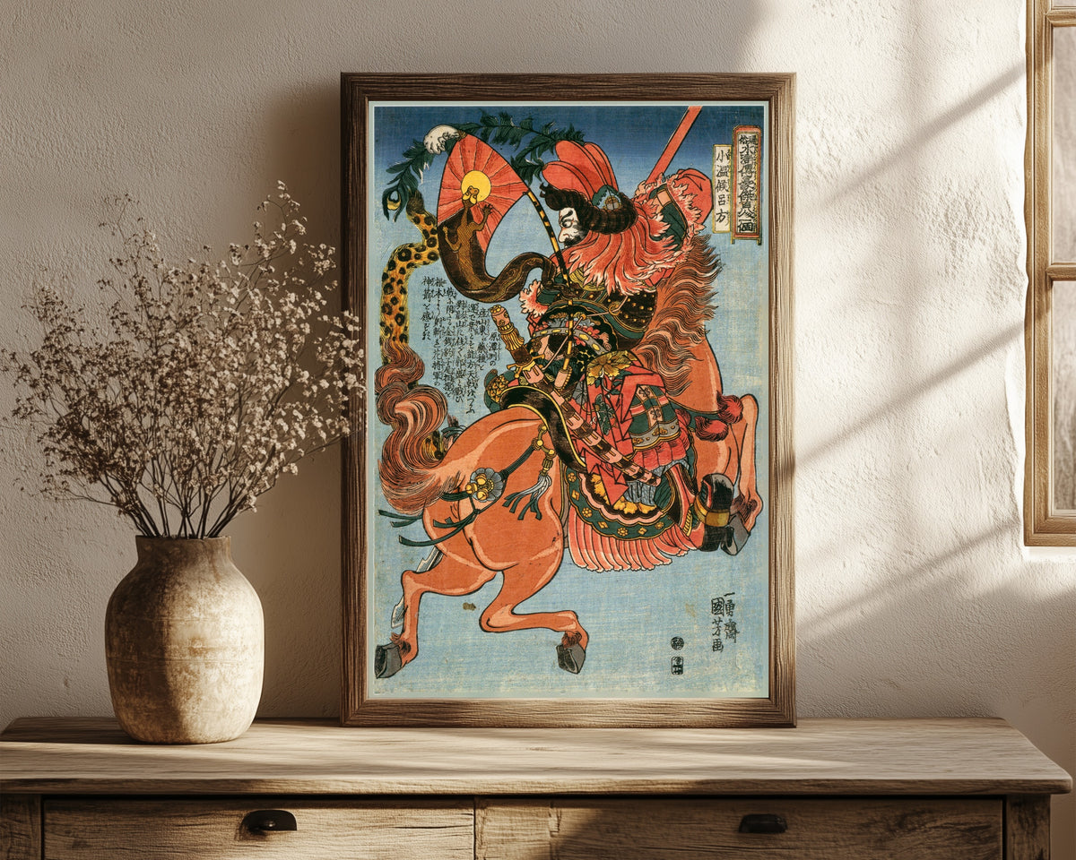 Framed art print of 108 Heroes of the Suikoden: Shōonkō Ryohō… by Utagawa Kuniyoshi, in a dark wood frame leaning on a rustic console beside dried flowers