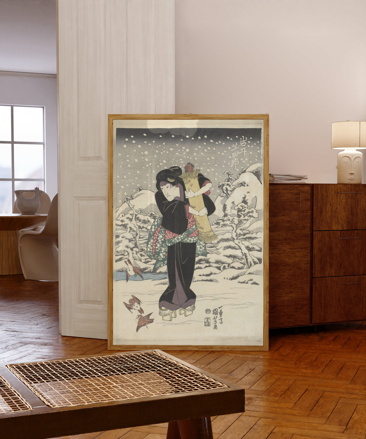 Framed art print of Iwai Hanshirō V by Utagawa Kuniyoshi, in a light wood frame leaning in a warm room with a parquet floor