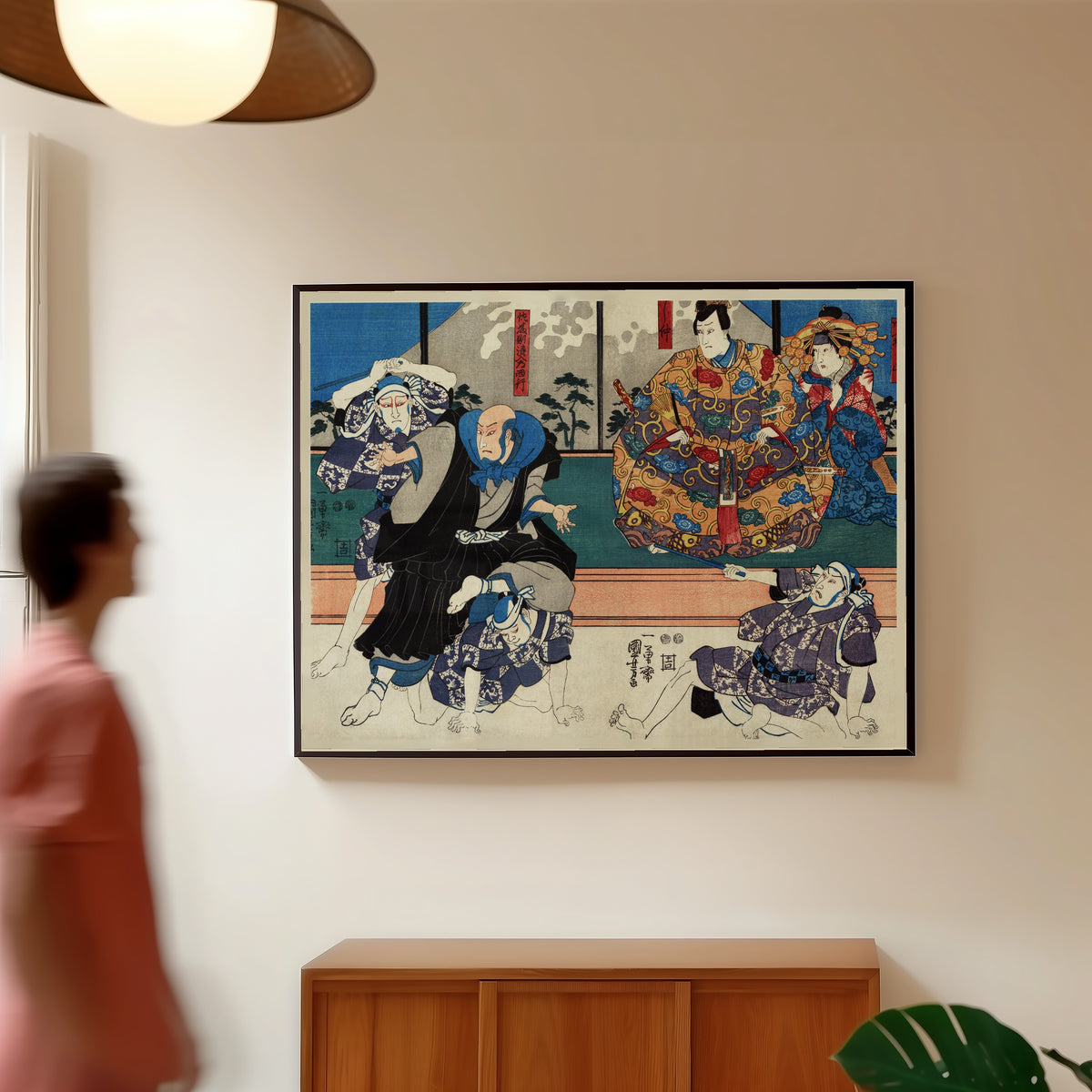 Framed art print of Satō Norikiyo Nyūdō Saigyō by Utagawa Kuniyoshi, in a slim black frame on a warm wall in a sunlit room