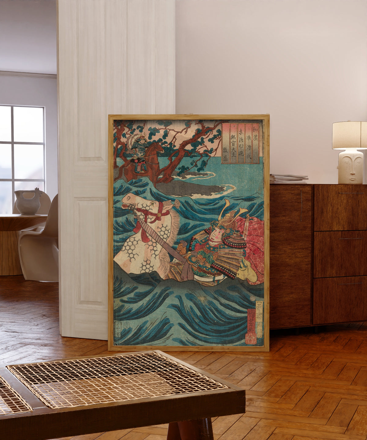 Framed art print of Suetsumuhana: Mukan-no-tayū Atsumori by Utagawa Kuniyoshi, in a light wood frame leaning in a warm room with a parquet floor
