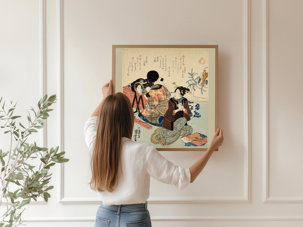 Two Women Back to Back, One with a Mirror by Utagawa Kuniyoshi — being hung, framed, on a panelled wall
