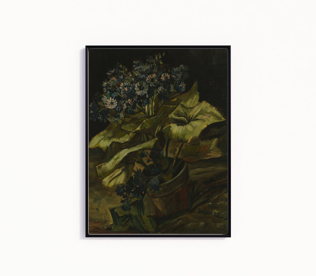 Framed art print of Cineraria by Vincent van Gogh, in a slim black frame on a plain white wall