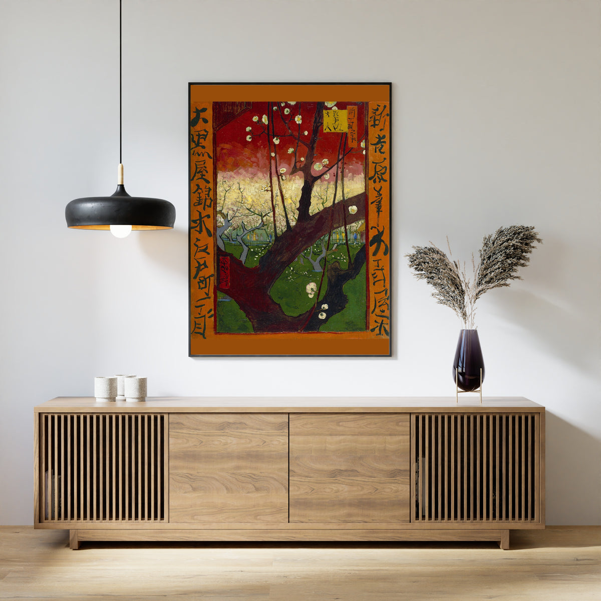 Flowering Plum Orchard (after Hiroshige) by Vincent van Gogh — framed above a slatted wood sideboard