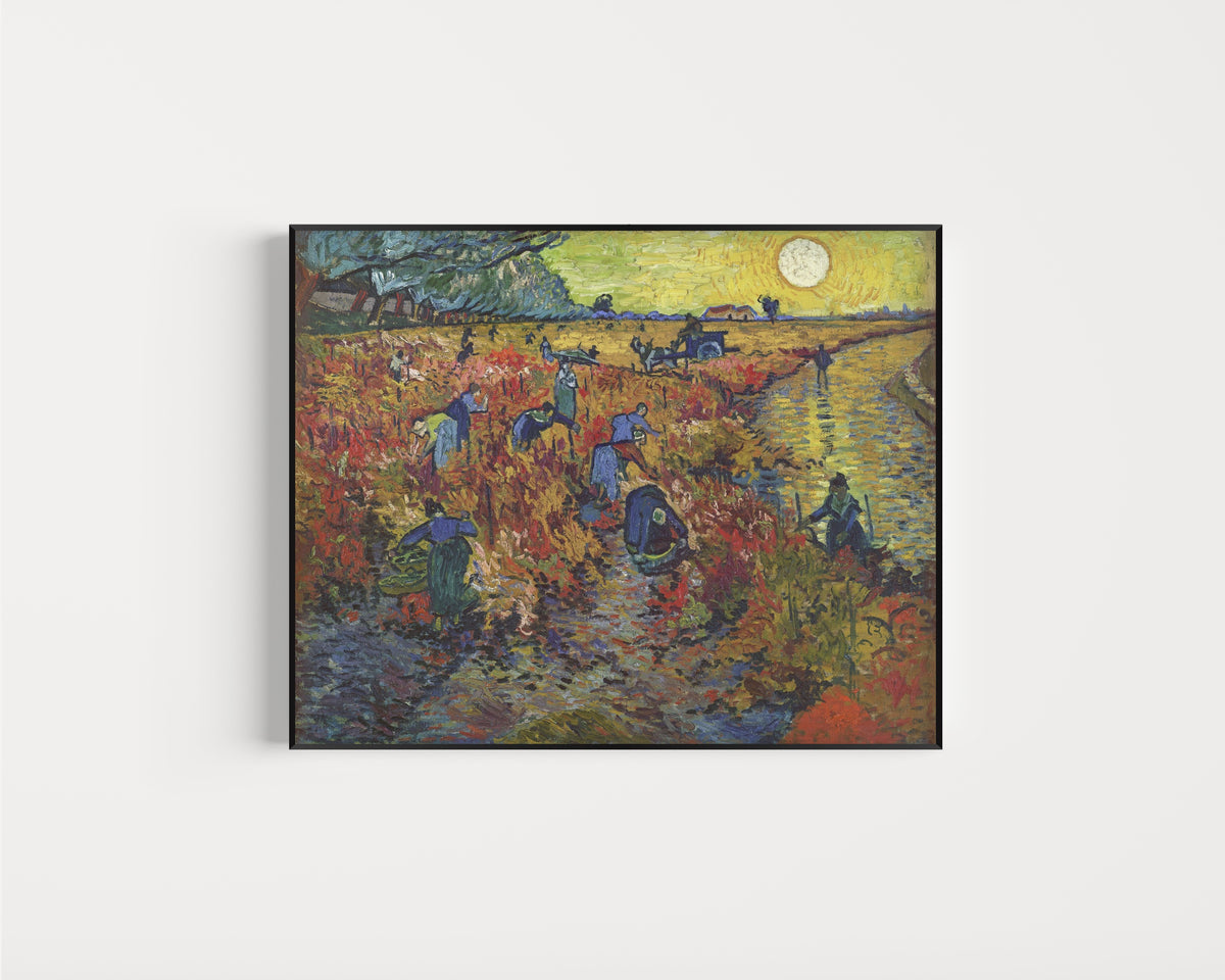Framed art print of The Red Vineyard by Vincent van Gogh, in a slim black frame on a plain white wall