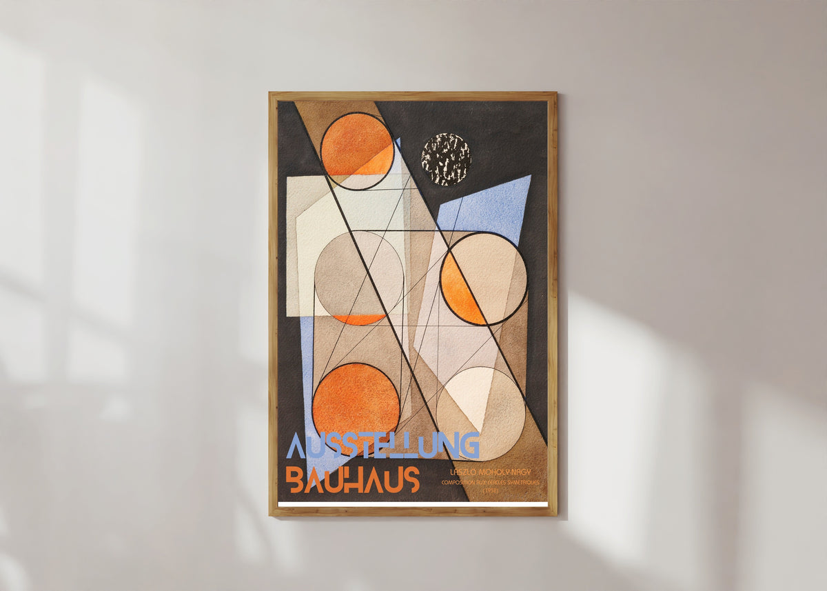 Framed art print of Composition aux Cercles Symétriques by László Moholy-Nagy, in a light wood frame on a sunlit white wall