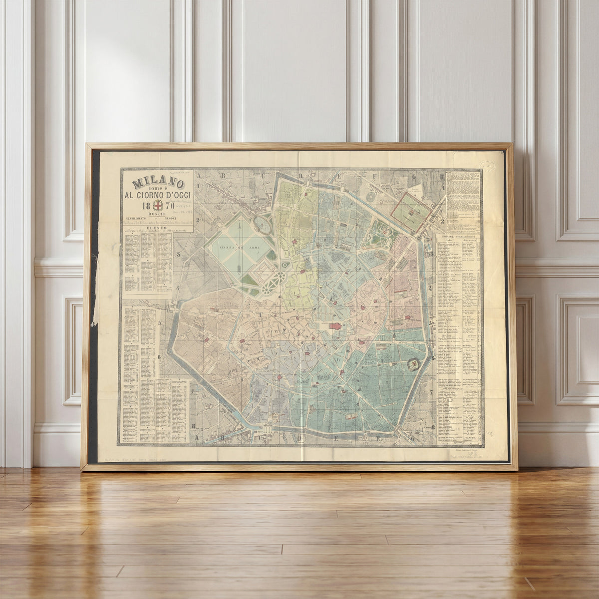 Framed art print of Milano come è al giorno d'oggi (1870), in a light wood frame leaning against a panelled white wall