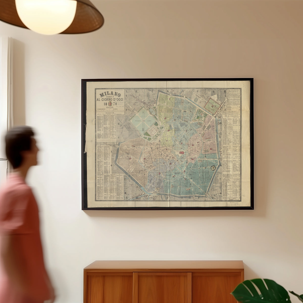 Framed art print of Milano come è al giorno d'oggi (1870), in a slim black frame on a warm wall in a sunlit room