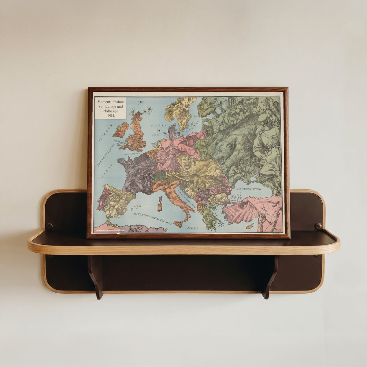 Framed art print of Momentaufnahme von Europa und Halbasien 1914 by W. Kaspar, in a dark wood frame resting on a wall shelf