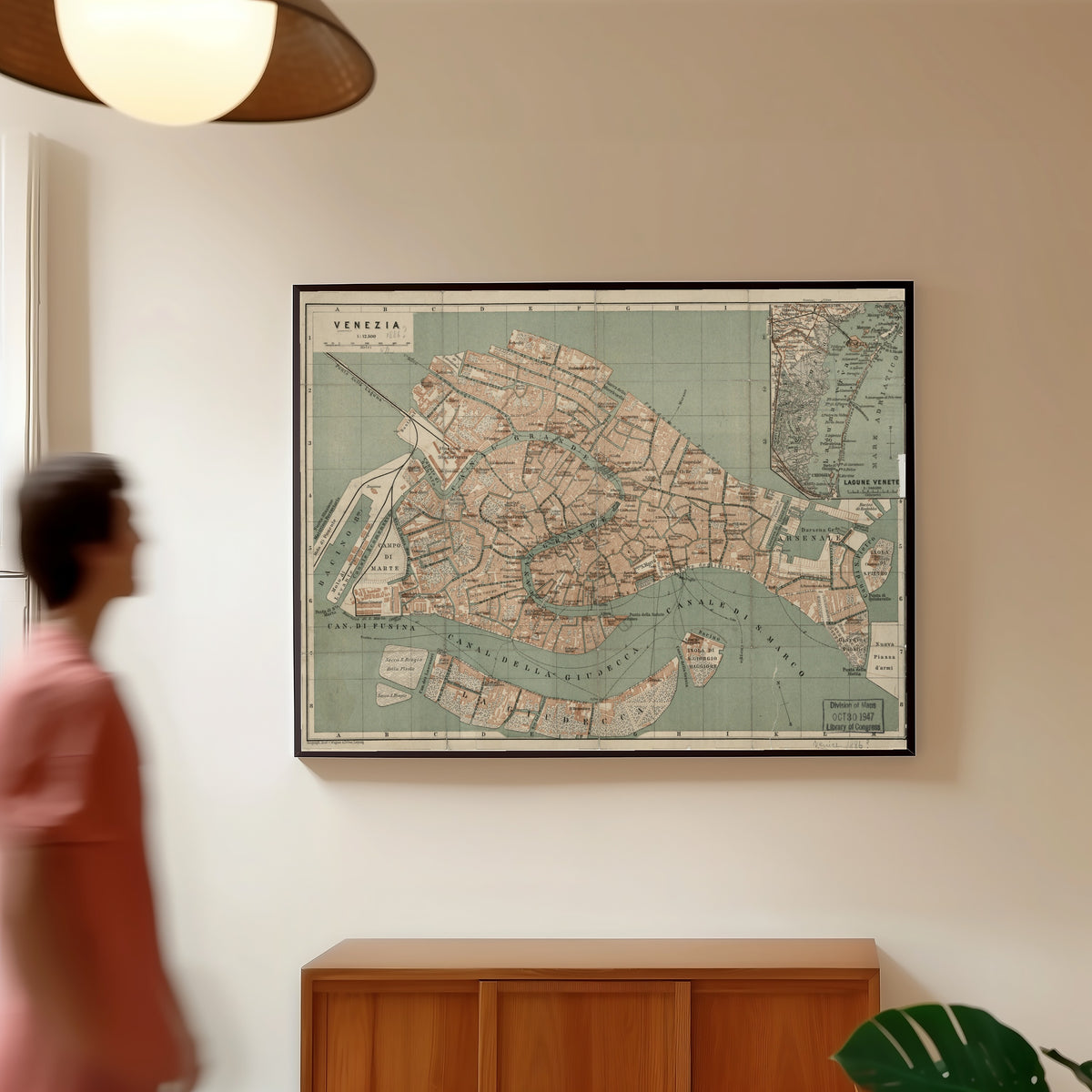 Framed art print of Venezia by Wagner & Debes, in a slim black frame on a warm wall in a sunlit room