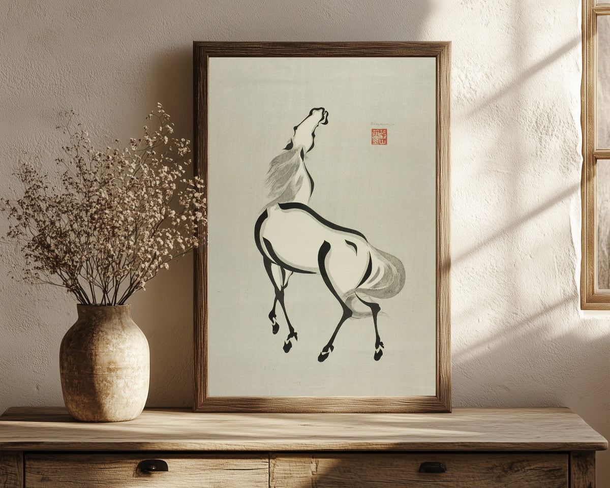 Framed art print of Horse with Raised Head by Wakyosai, in a dark wood frame leaning on a rustic console beside dried flowers