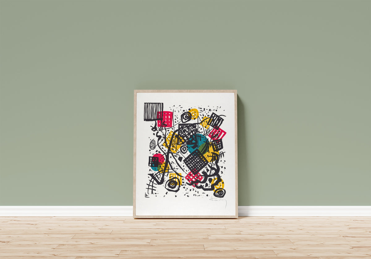 Framed art print of Small Worlds V by Wassily Kandinsky, in a light wood frame leaning on a sage green wall above a wooden floor