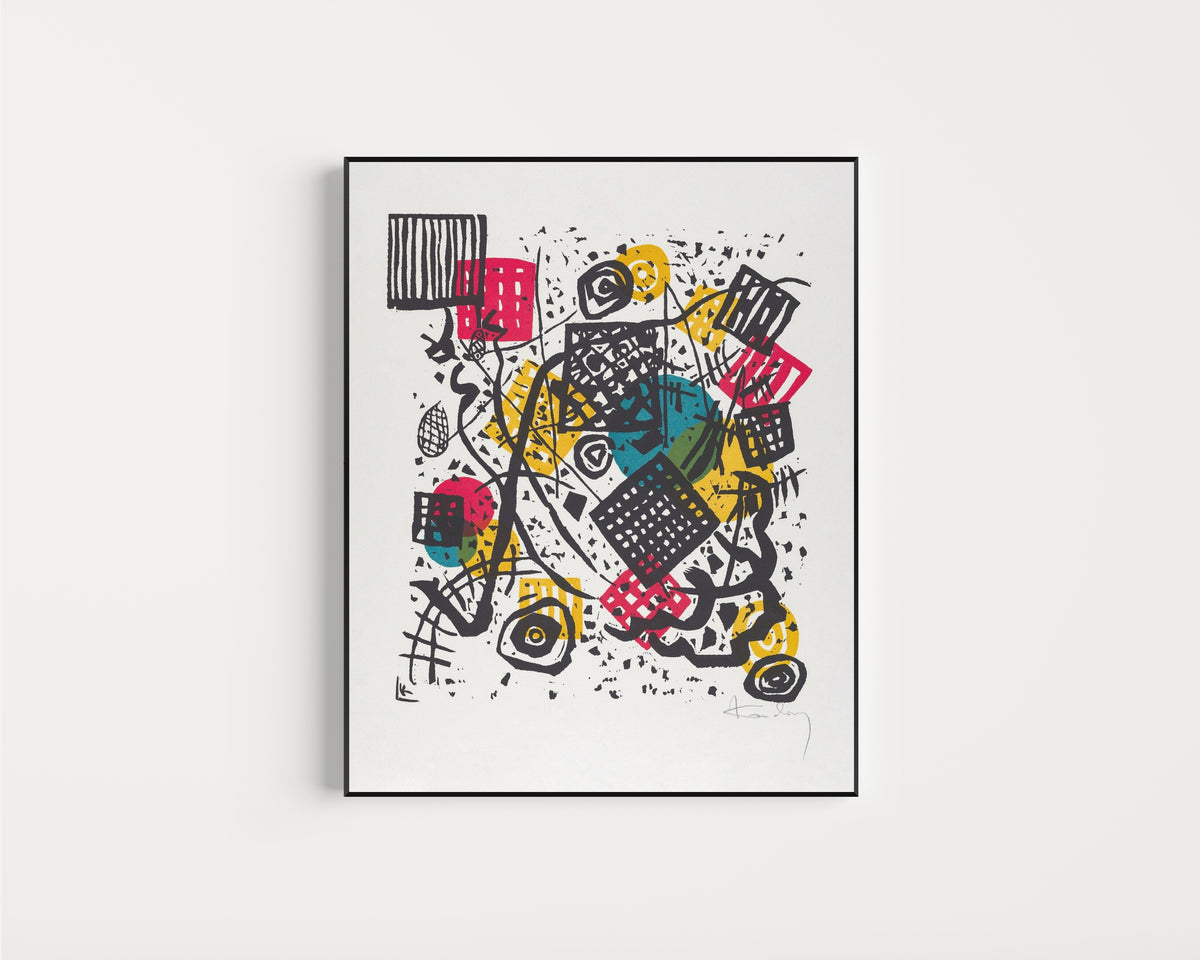 Framed art print of Small Worlds V by Wassily Kandinsky, in a slim black frame on a plain white wall