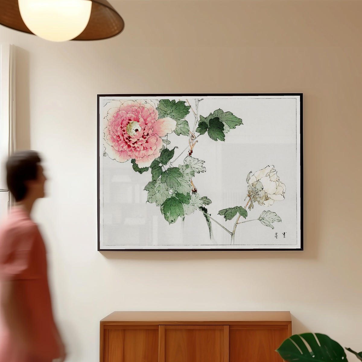 Framed art print of Tree Peony by Watanabe Seitei, in a slim black frame on a warm wall in a sunlit room