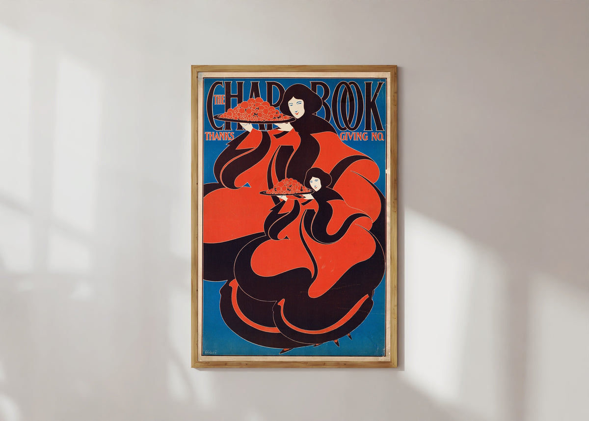 Framed art print of The Chap-Book, Thanksgiving Number, 1895 by Will Bradley, in a light wood frame on a sunlit white wall