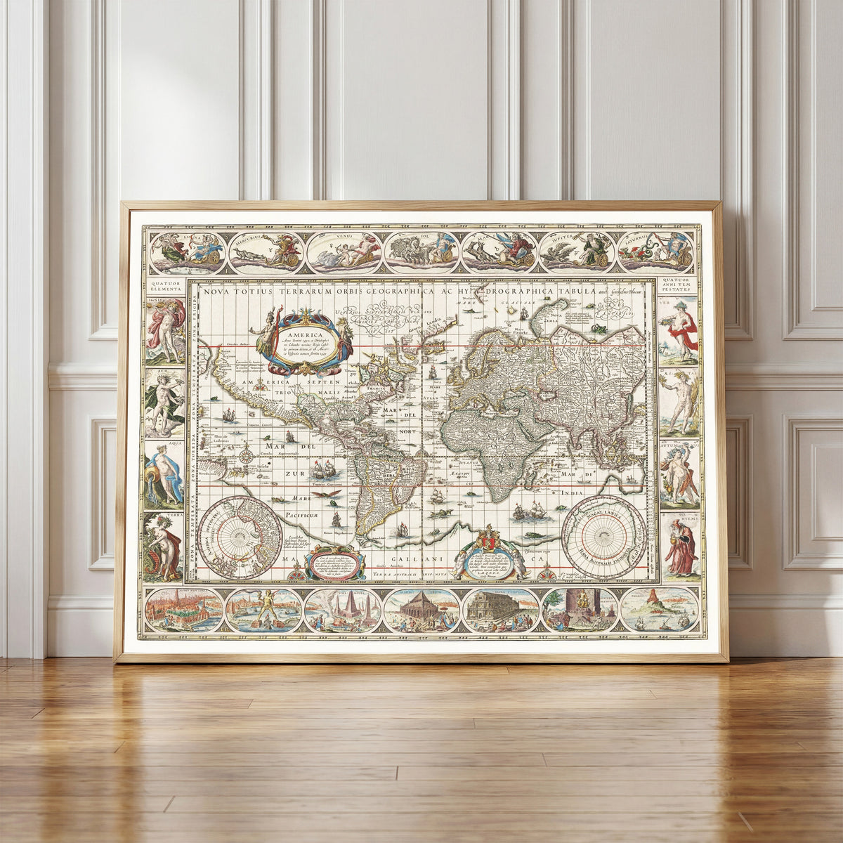 Framed art print of Nova Totius Terrarum Orbis Geographica ac… by Willem Janszoon Blaeu, in a light wood frame leaning against a panelled white wall