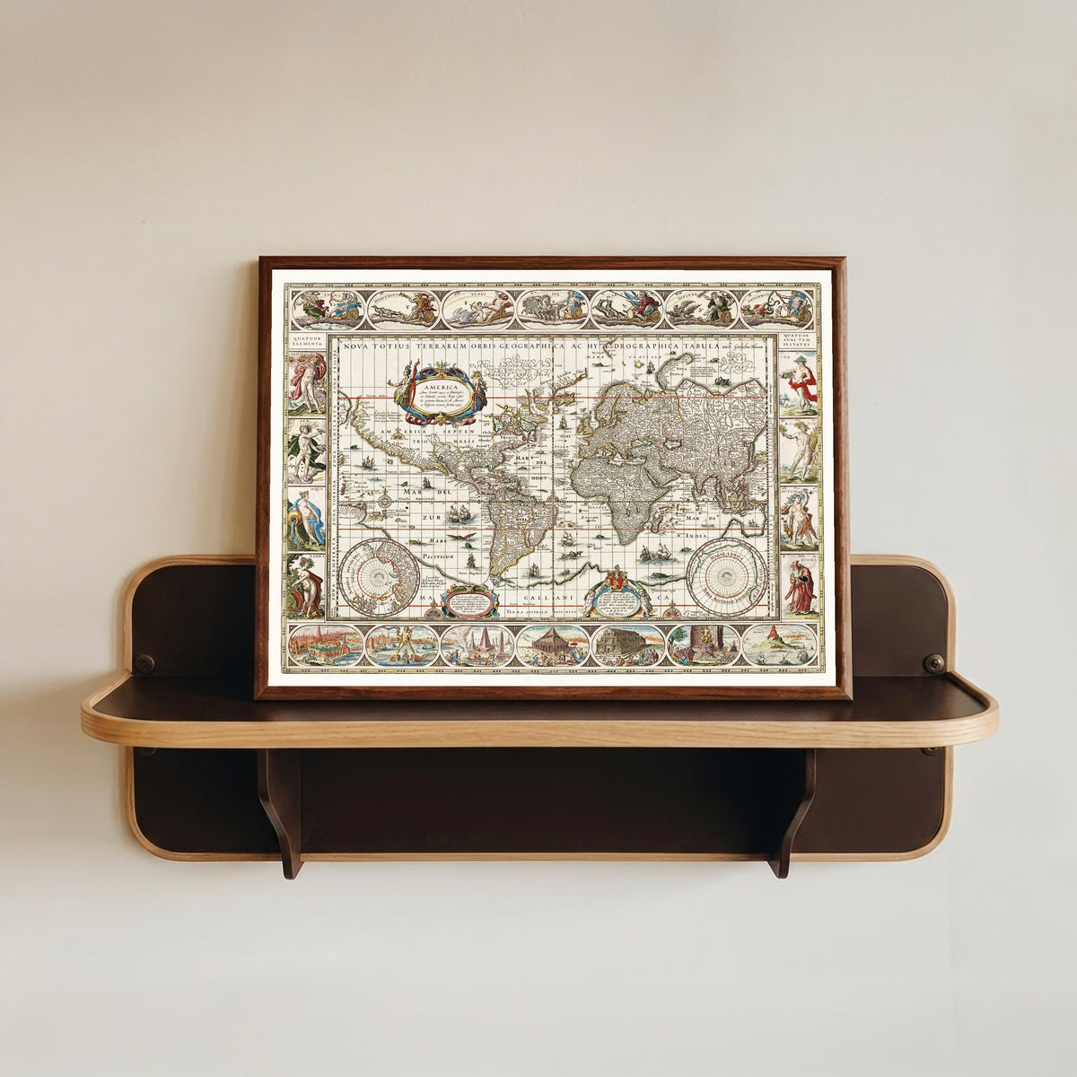 Framed art print of Nova Totius Terrarum Orbis Geographica ac Hydrographica Tabula by Willem Janszoon Blaeu, in a dark wood frame resting on a wall shelf