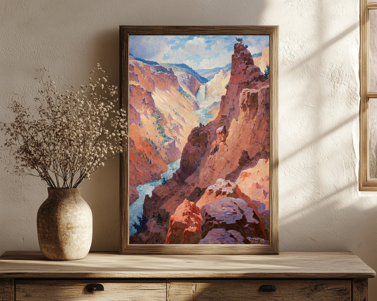 Framed art print of View of the Grand Canyon of the Yellowstone by William Robinson Leigh, in a dark wood frame leaning on a rustic console beside dried flowers