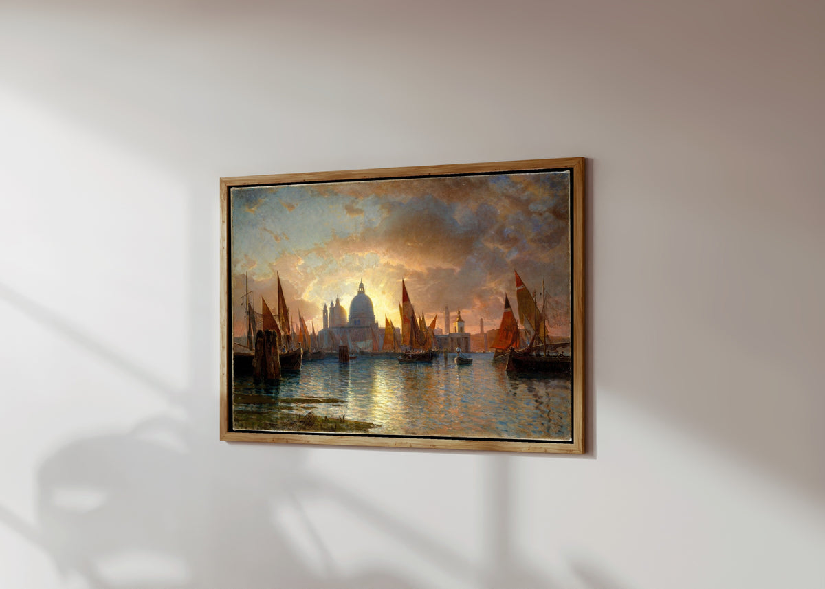 Framed art print of Santa Maria della Salute Sunset Seascape by William Stanley Haseltine, in a light wood frame on a sunlit white wall, seen at a slight angle