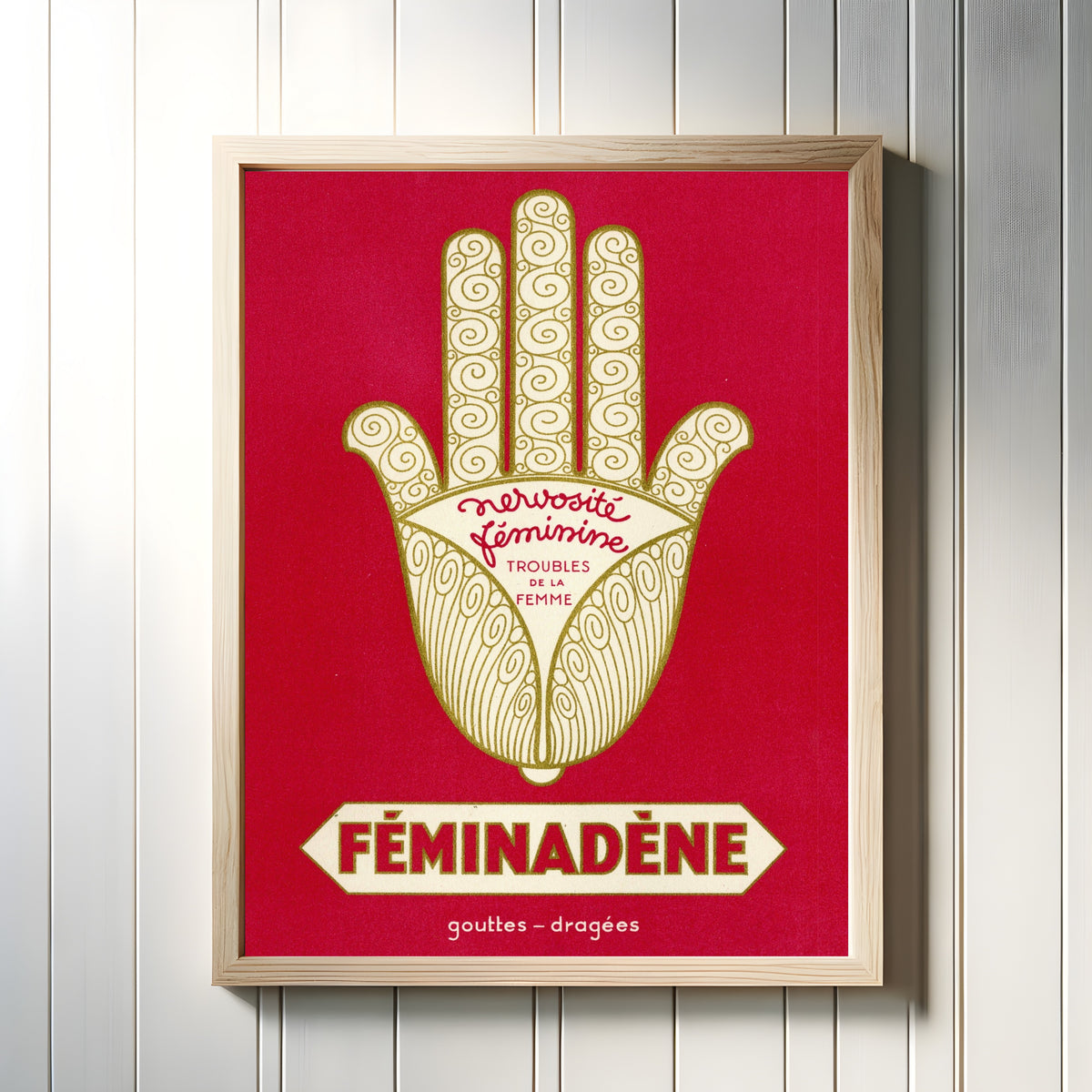 Framed art print of Vintage French Pharmaceutical Poster Print in Red, in a light wood frame on a white panelled wall