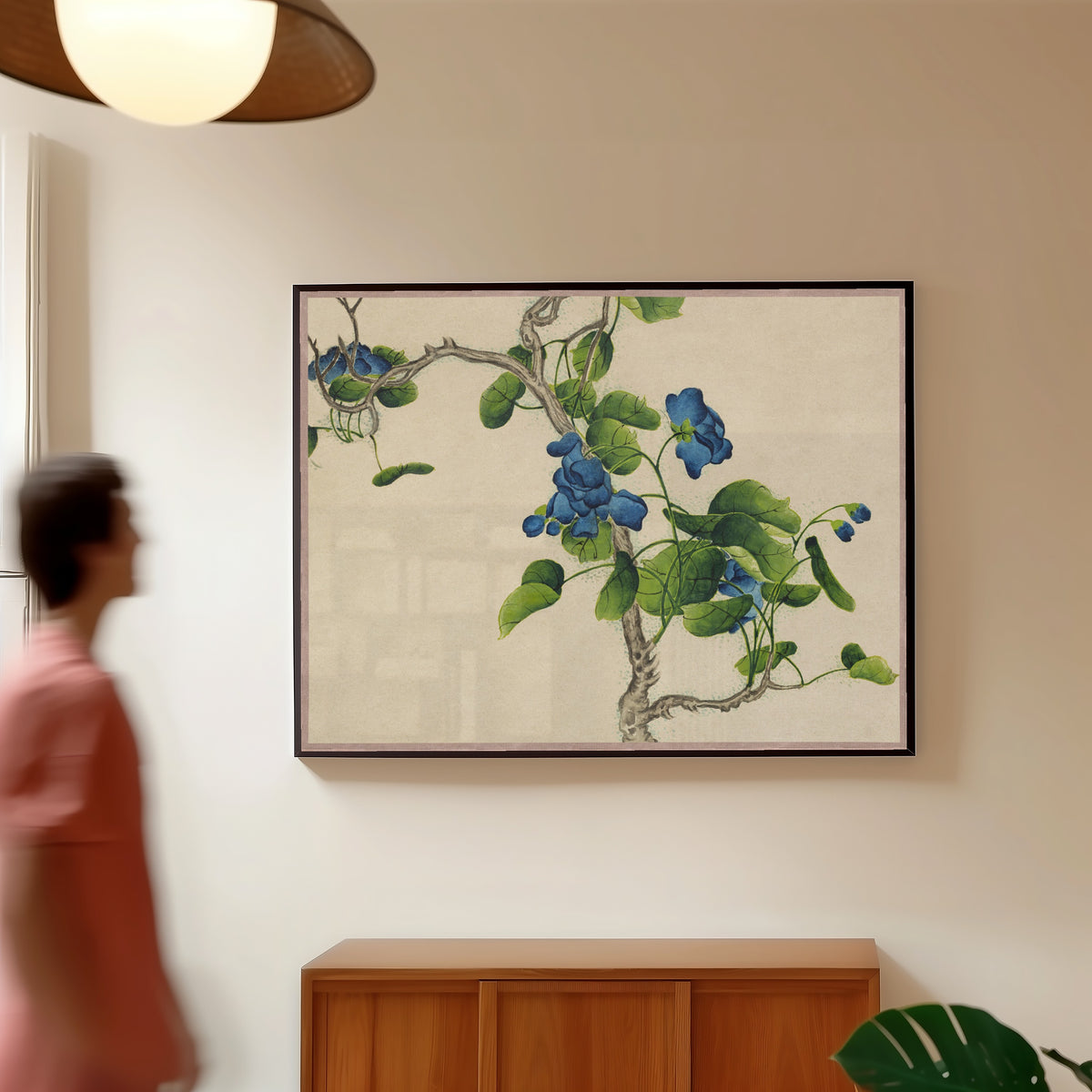 Framed art print of Desk Album: Flower and Bird Paintings (Climbing Blue Flowers) by Zhang Ruoai, in a slim black frame on a warm wall in a sunlit room