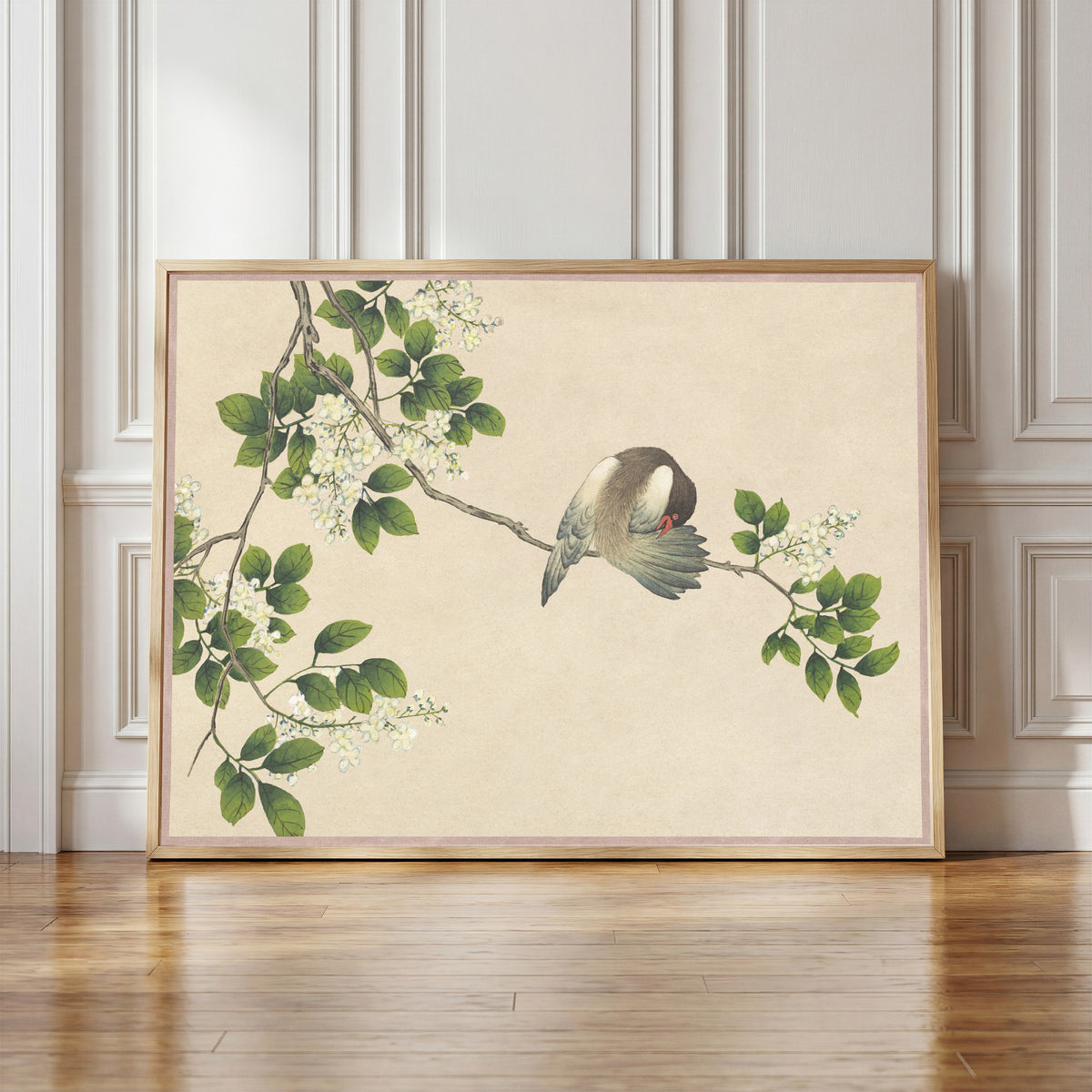 Framed art print of Desk Album: Flower and Bird Paintings (Preening Bird) by Zhang Ruoai, in a light wood frame leaning against a panelled white wall